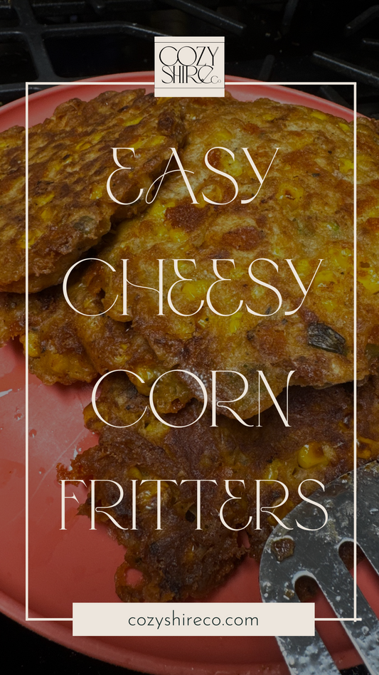 Easy cheesy corn fritters piled on a pink plate with cozyshire branding and website